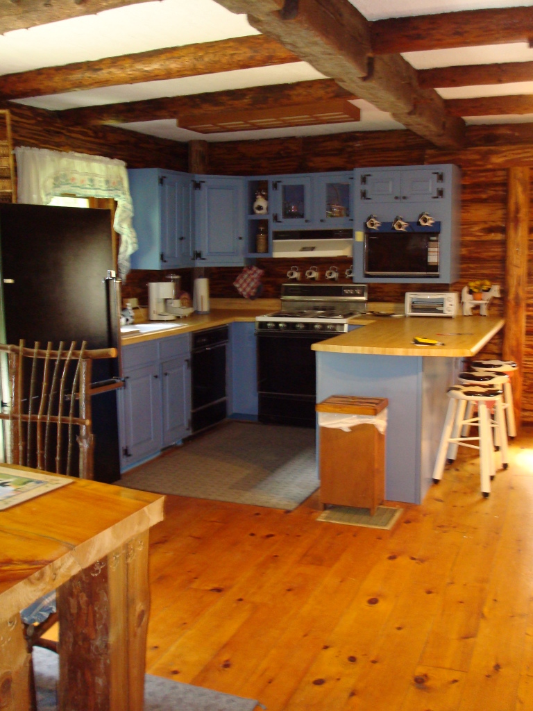 20 George Carter Road Becket, MA 01223 - Photo 5 of 10 a kitchen with stainless steel appliances kitchen island granite countertop a stove a sink and a microwave