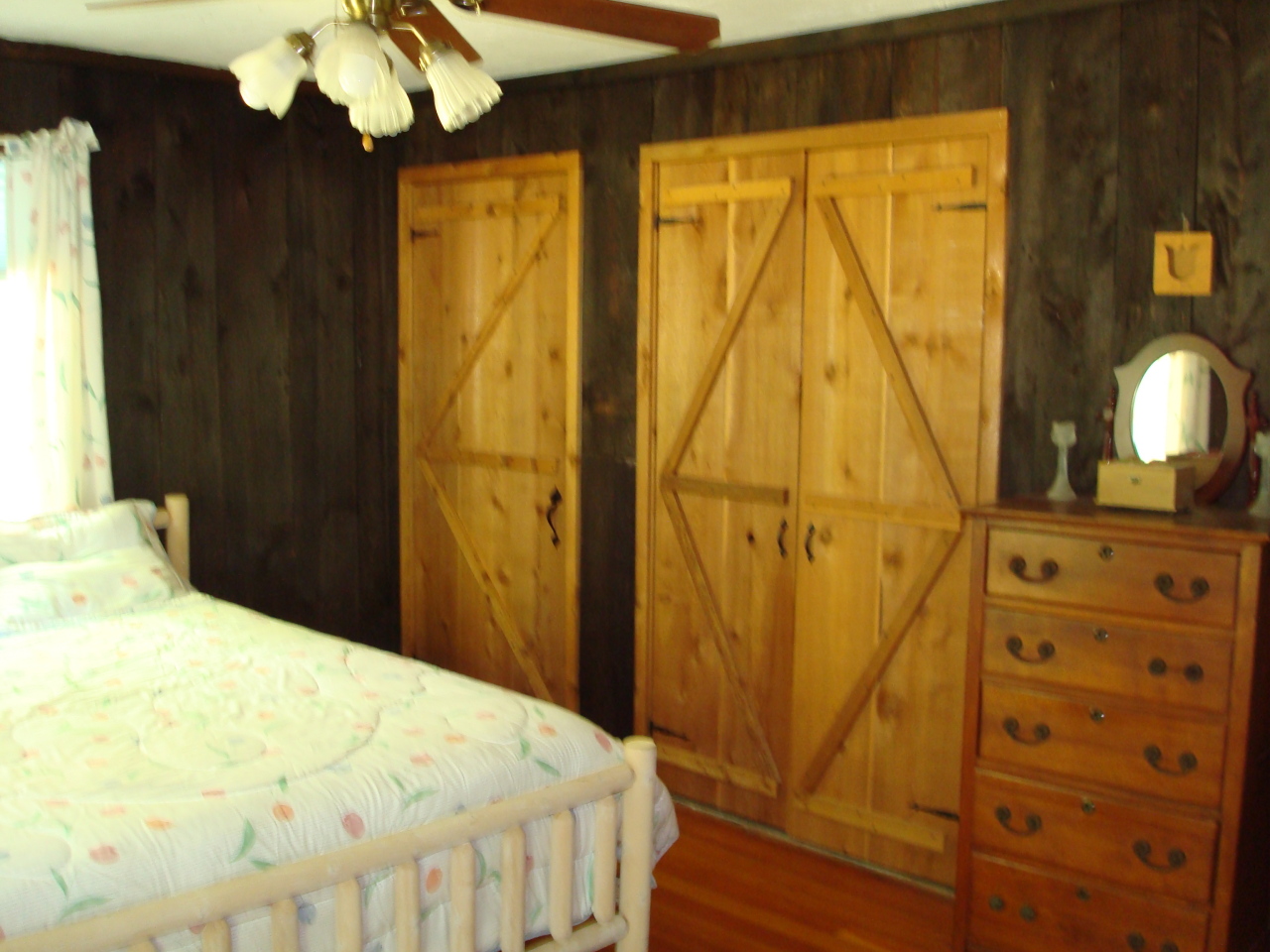 20 George Carter Road Becket, MA 01223 - Photo 8 of 10 a bedroom with a bed and dresser with mirror