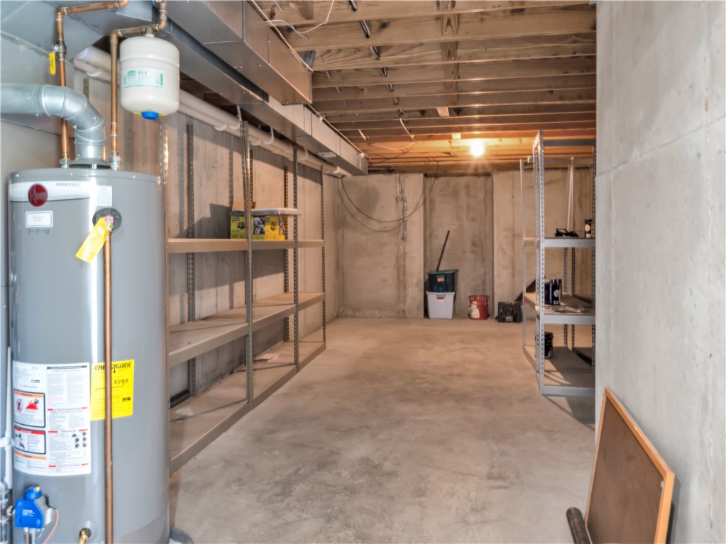 25 Callaway Springboro, OH 45066 - Photo 40 of 51 This expansive basement offers an unfinished space with concrete flooring, perfect for storage or future customization.
