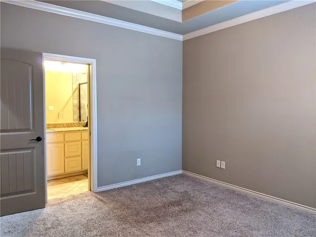 a bathroom with a granite countertop sink a mirror and shower