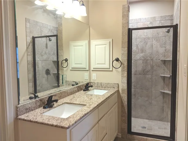 a view of a bathroom with a glass door