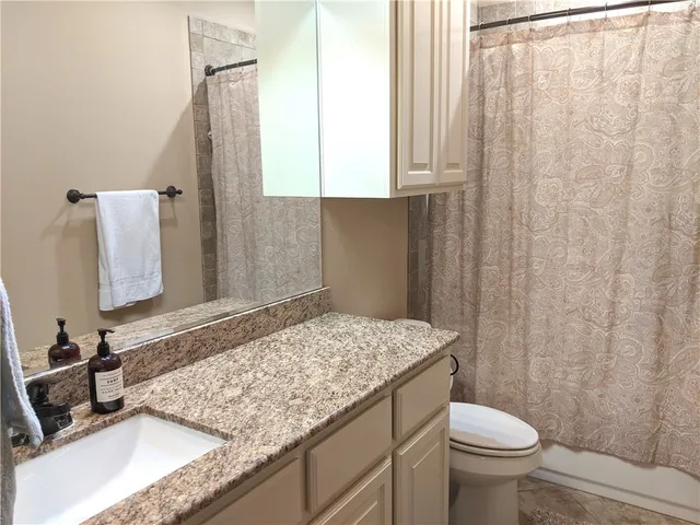 a view of backyard with tub