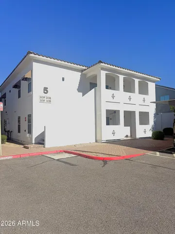 a view of white house with a road