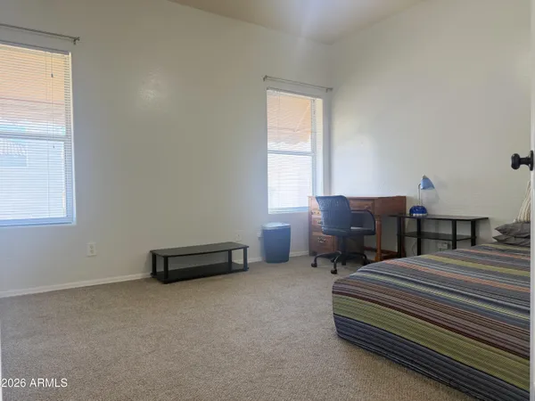 a bathroom with a sink toilet and a mirror