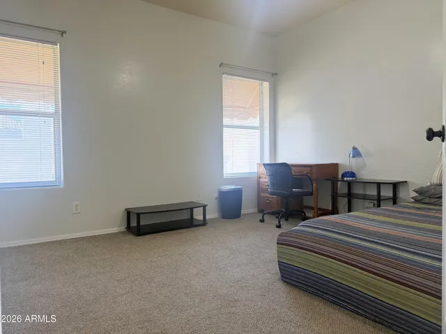 a bathroom with a sink toilet and a mirror