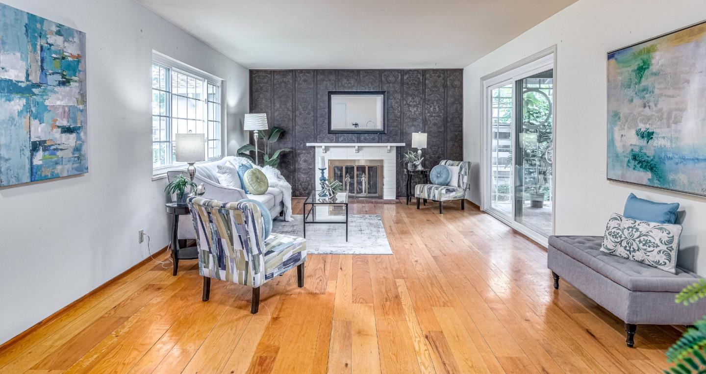 1122 Merrimac Drive Sunnyvale, CA 94087 - Photo 11 of 26 a living room with furniture and a fireplace