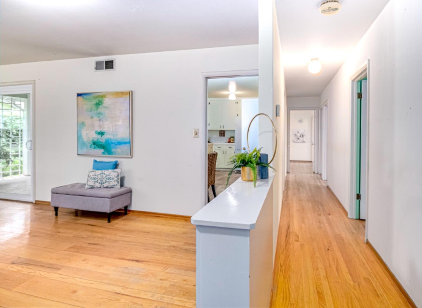 1122 Merrimac Drive Sunnyvale, CA 94087 - Photo 13 of 26 a living room with furniture and a potted plant