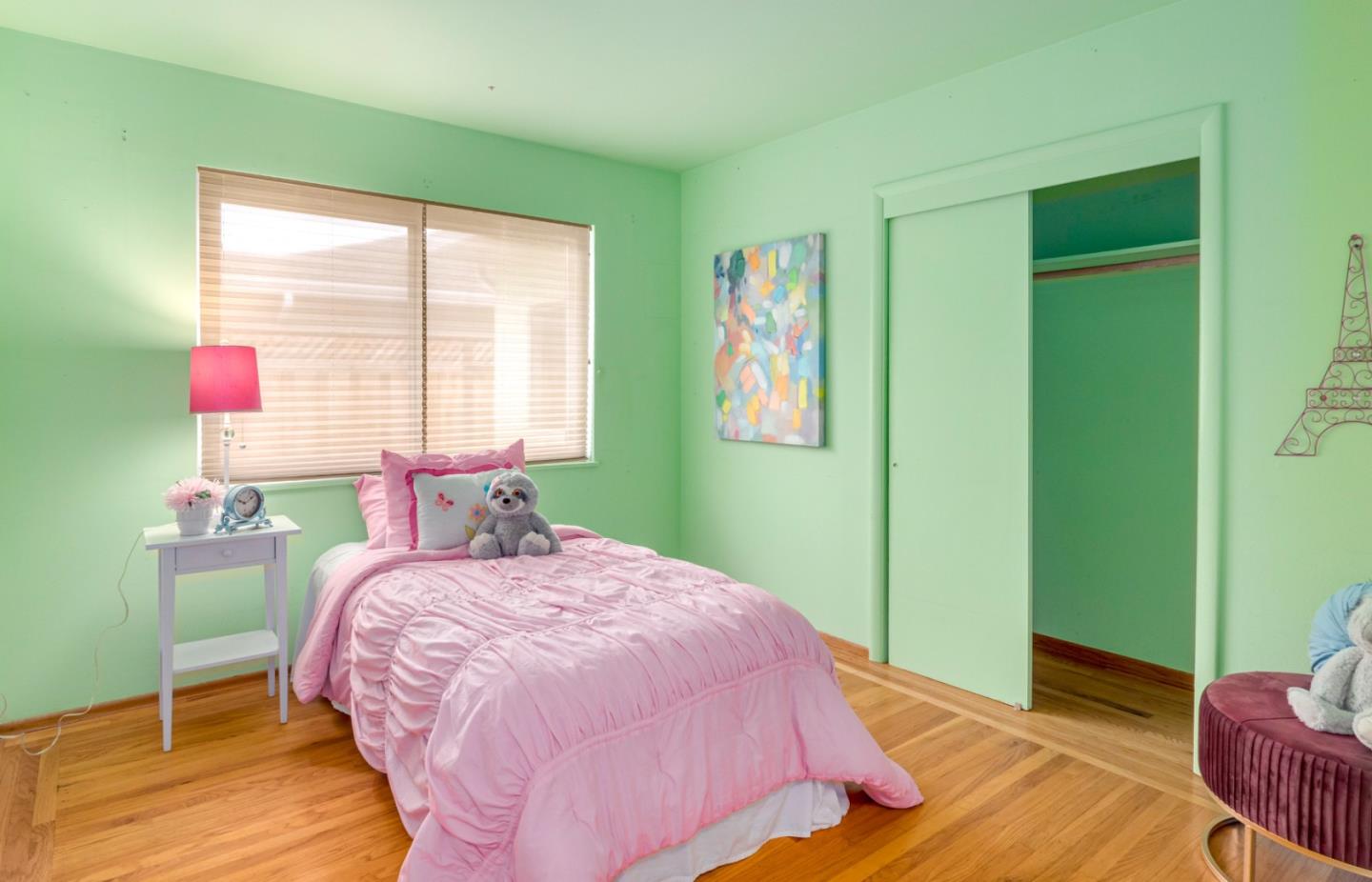 1122 Merrimac Drive Sunnyvale, CA 94087 - Photo 17 of 26 a bedroom with a bed and a window