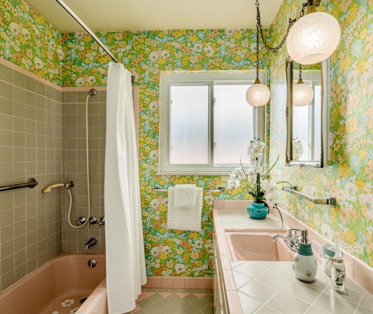 1122 Merrimac Drive Sunnyvale, CA 94087 - Photo 21 of 26 a bathroom with a sink mirror and a bathtub