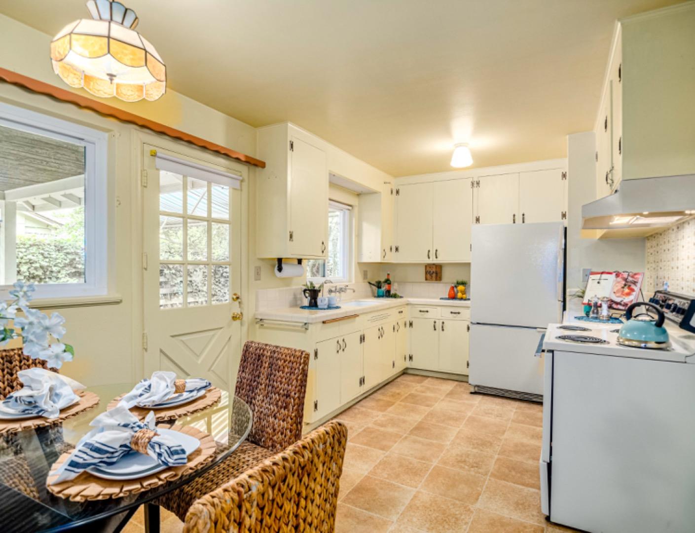 1122 Merrimac Drive Sunnyvale, CA 94087 - Photo 5 of 26 a large kitchen with a table and chairs in it