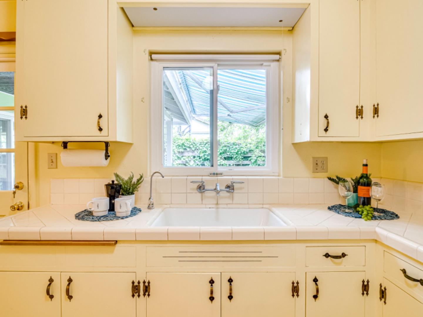 1122 Merrimac Drive Sunnyvale, CA 94087 - Photo 7 of 26 a bathroom with a sink and a window
