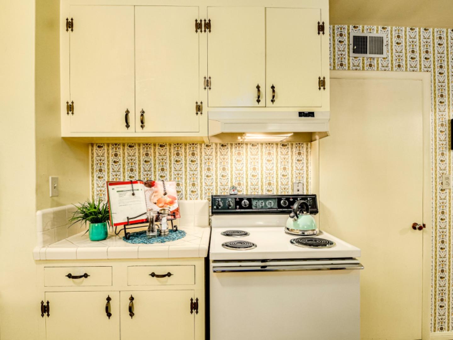 1122 Merrimac Drive Sunnyvale, CA 94087 - Photo 8 of 26 a view of a kitchen with stainless steel appliances