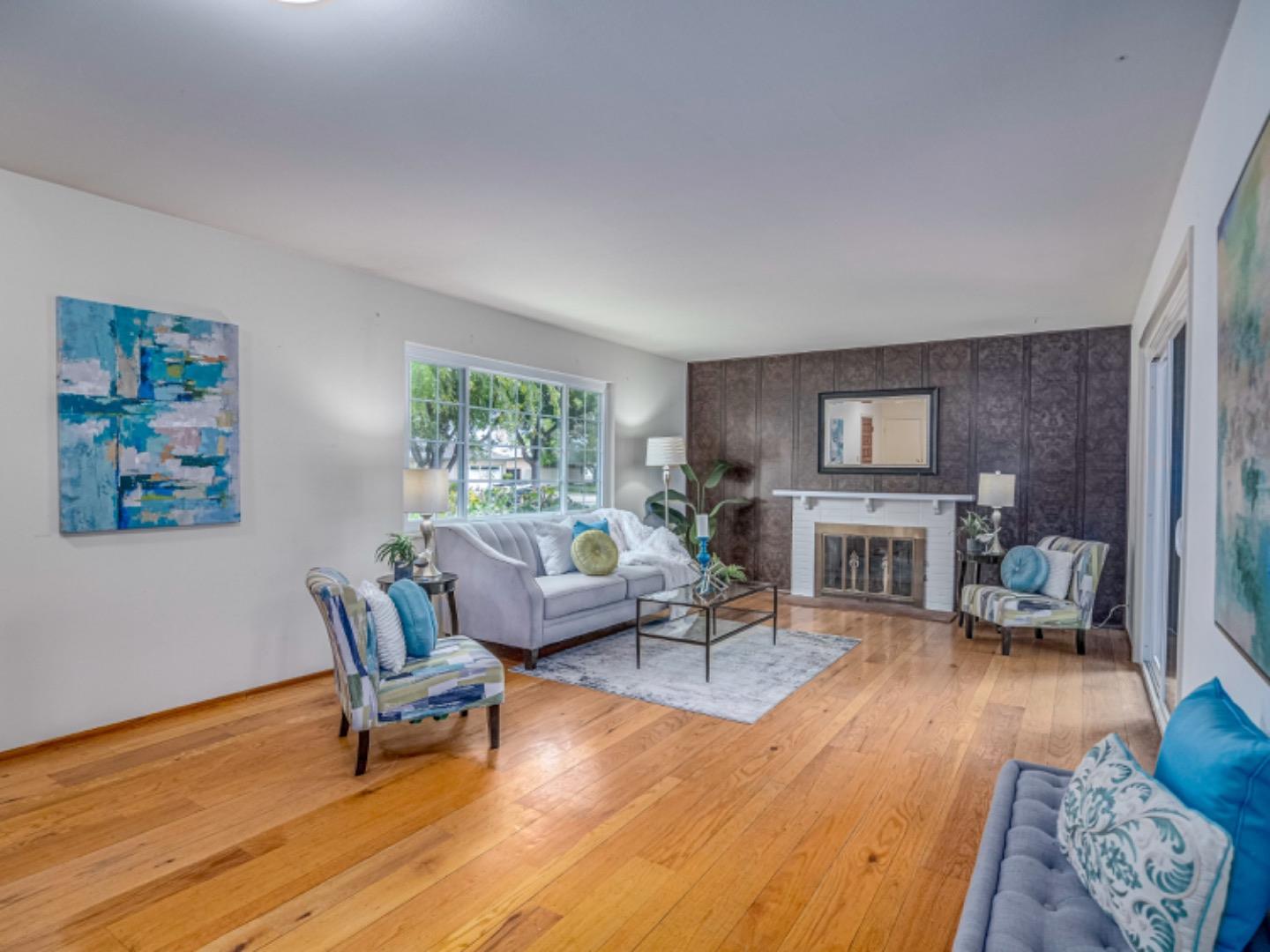 1122 Merrimac Drive Sunnyvale, CA 94087 - Photo 10 of 26 a living room with furniture and a wooden floor
