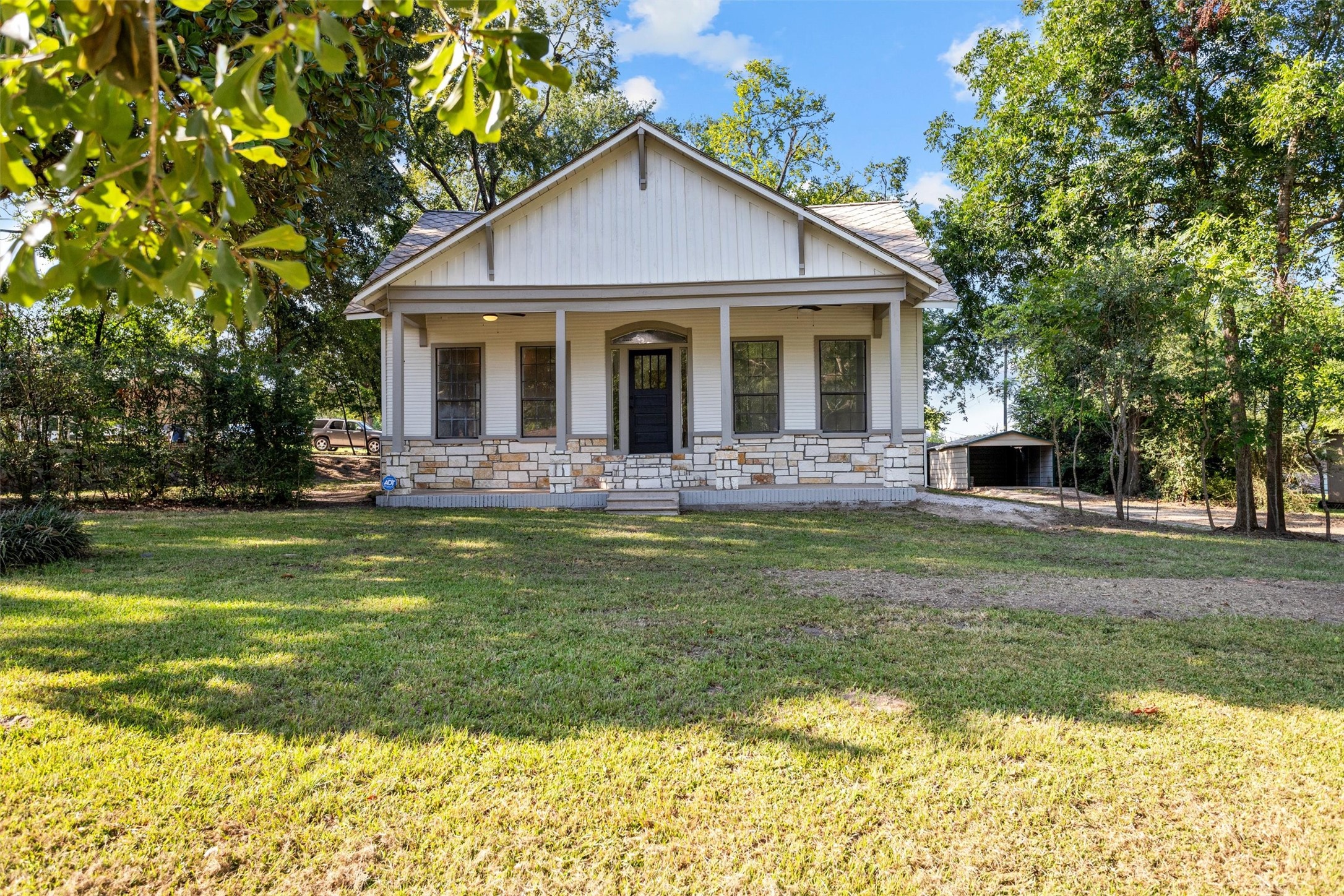 a front view of a house with garden