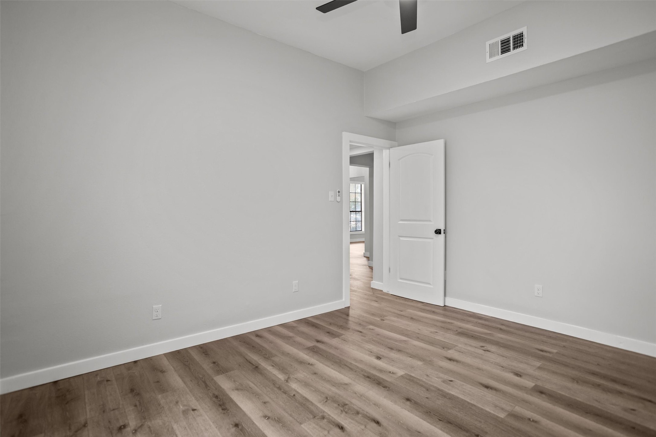 170 Noble Street Lovelady, TX 75851 - Photo 13 of 23 a view of an empty room with wooden floor