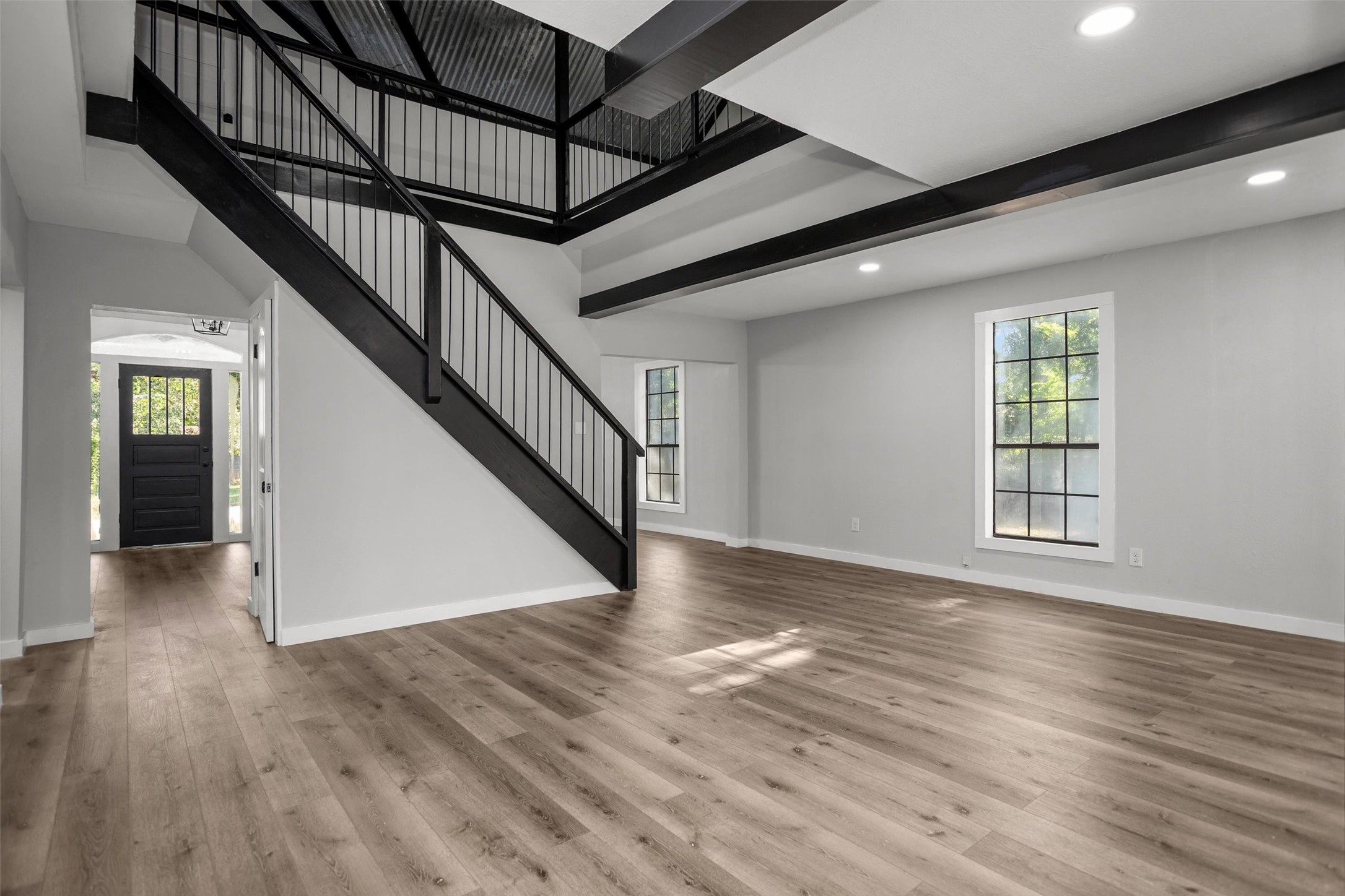 170 Noble Street Lovelady, TX 75851 - Photo 17 of 23 a view of an empty room with wooden floor and stairs