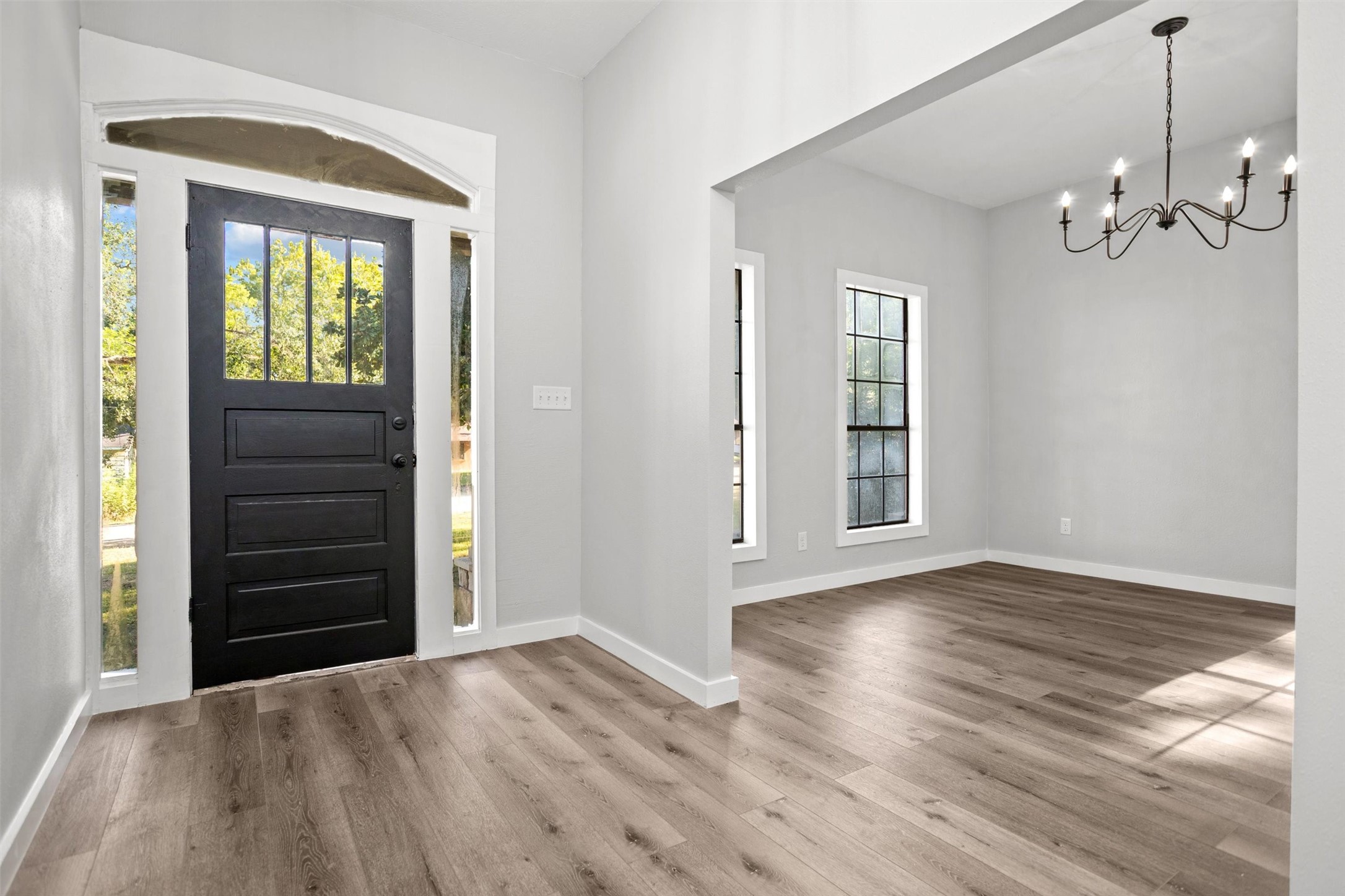 170 Noble Street Lovelady, TX 75851 - Photo 3 of 23 wooden floor in an empty room with a window