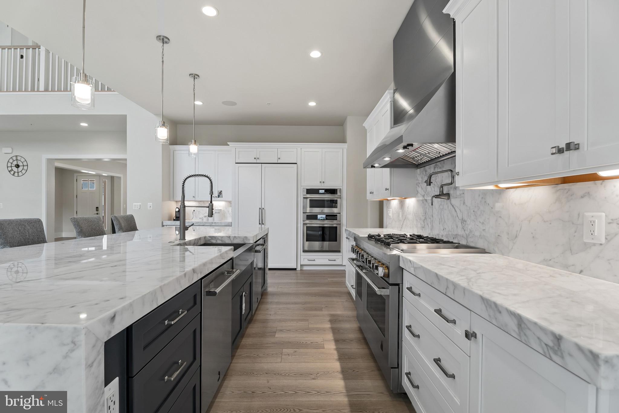 12444 Potomac Hunt Road North Potomac, MD 20878 - Photo 11 of 47 Sleek modern kitchen with marble elegance.