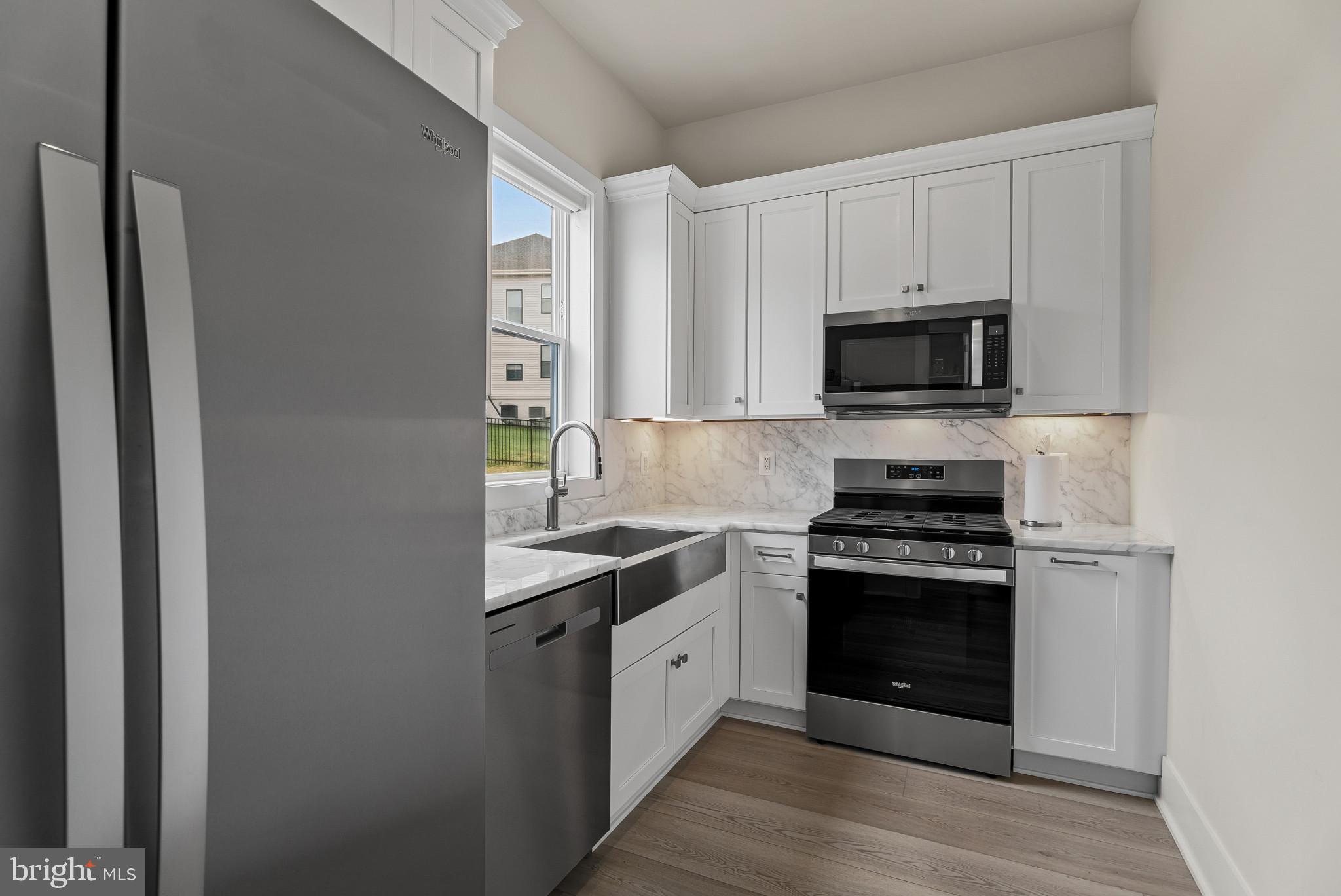 12444 Potomac Hunt Road North Potomac, MD 20878 - Photo 13 of 47 Modern kitchen with sleek finishes.