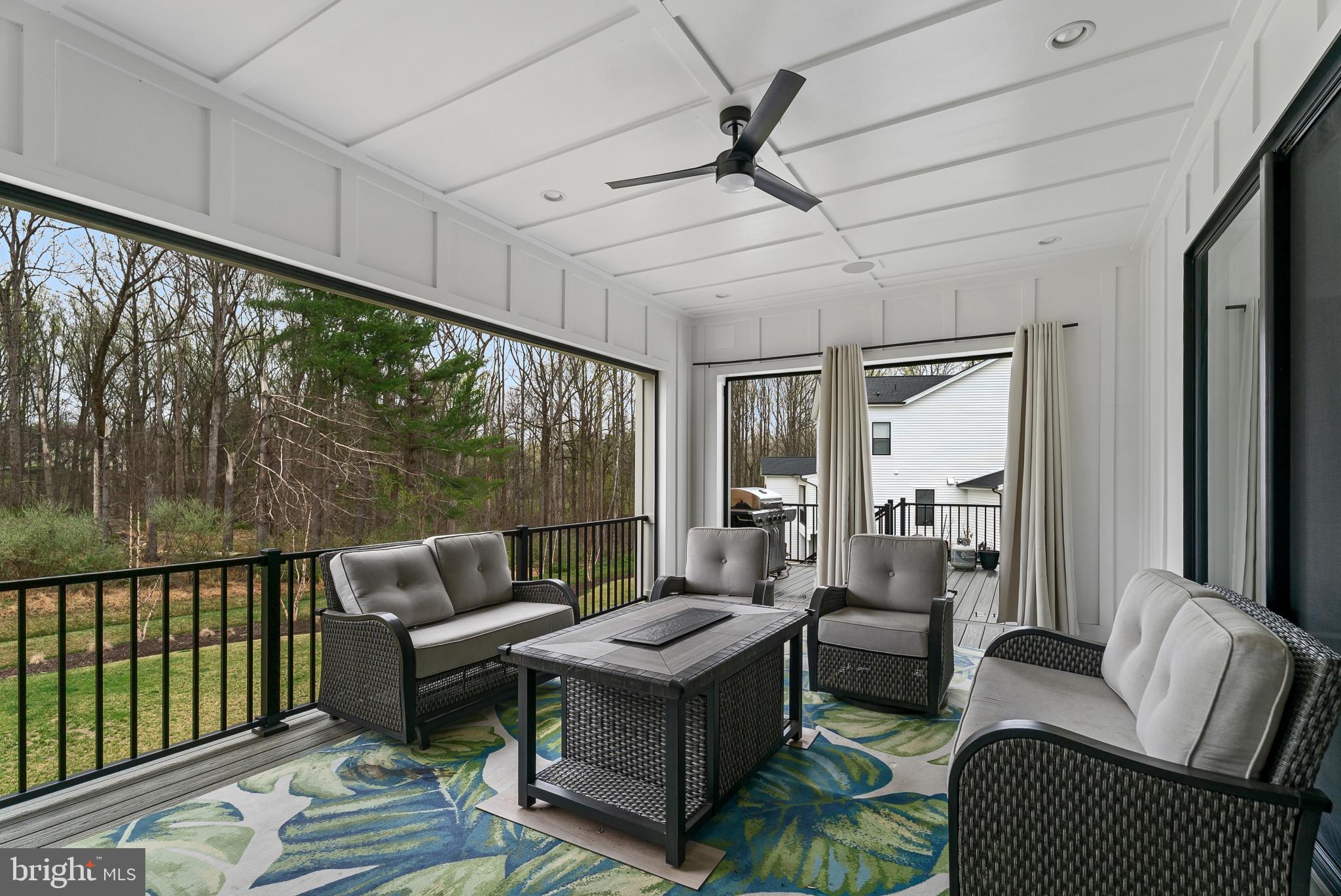 12444 Potomac Hunt Road North Potomac, MD 20878 - Photo 42 of 47 Serene screened porch with nature views.