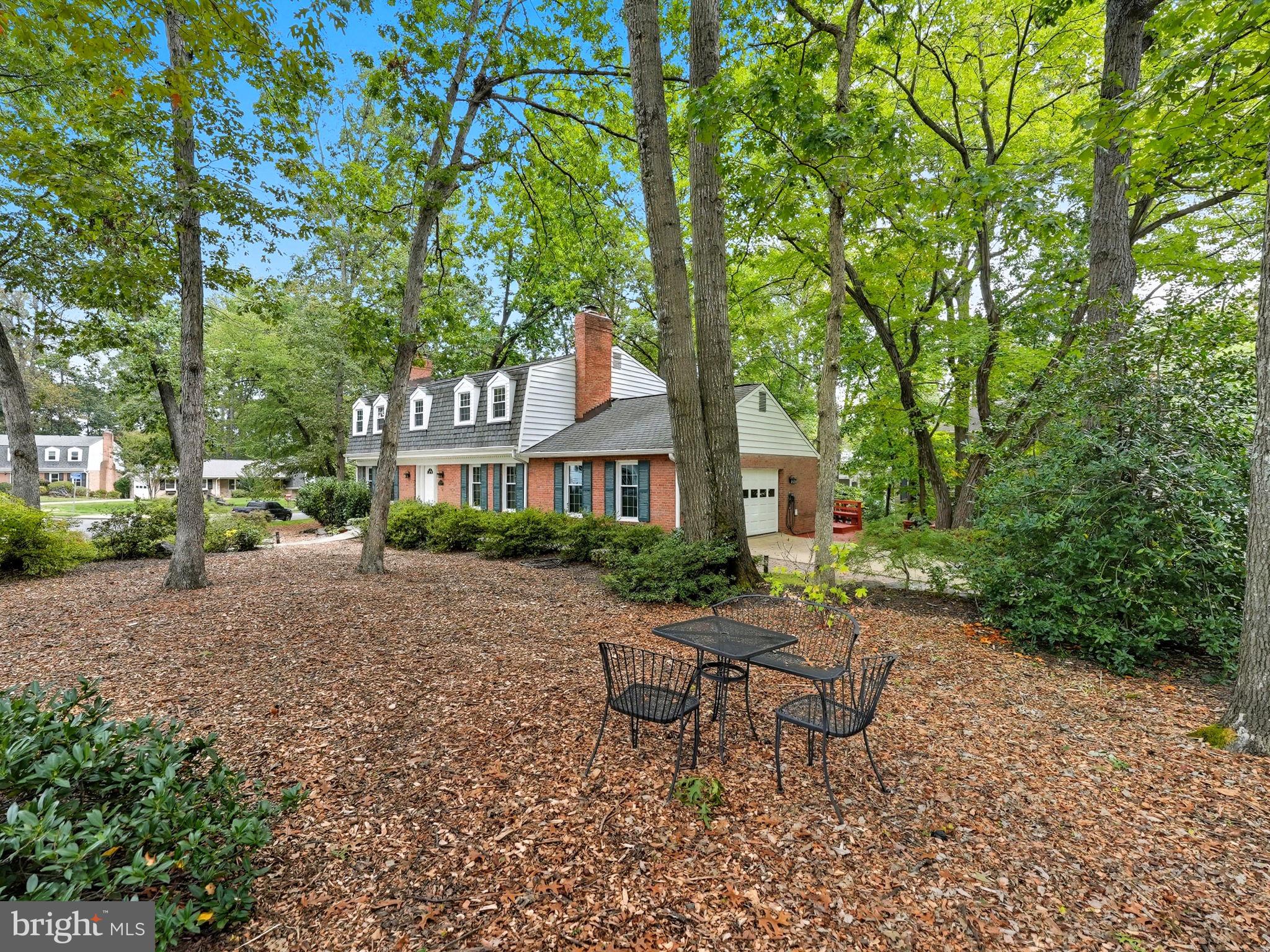 2350 Swaps Court Reston, VA 20191 - Photo 36 of 57 a front view of a house with a yard and trees