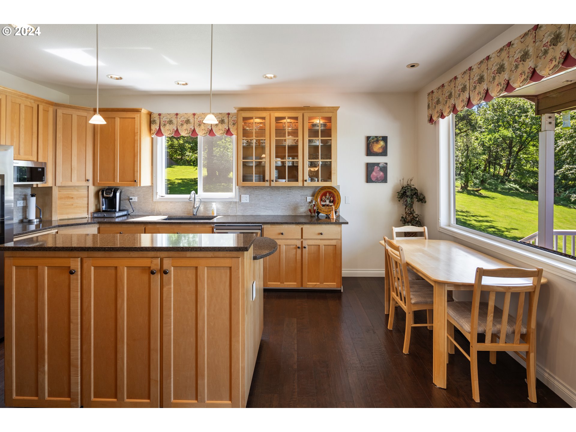 19100 Southwest Finnigan Hill Road Newberg, OR 97132 - Photo 11 of 48 a kitchen with stainless steel appliances granite countertop a sink and wooden cabinets