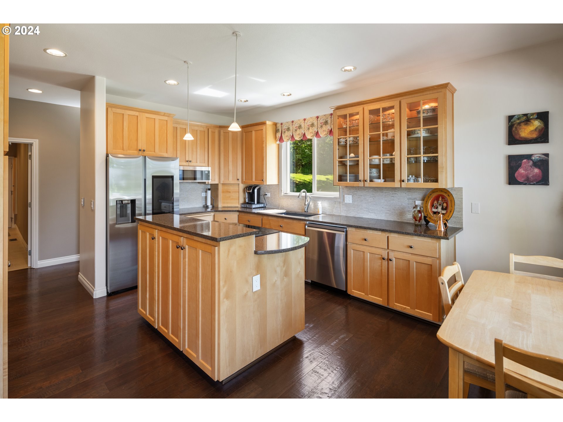 19100 Southwest Finnigan Hill Road Newberg, OR 97132 - Photo 12 of 48 a kitchen with a sink stove and cabinets