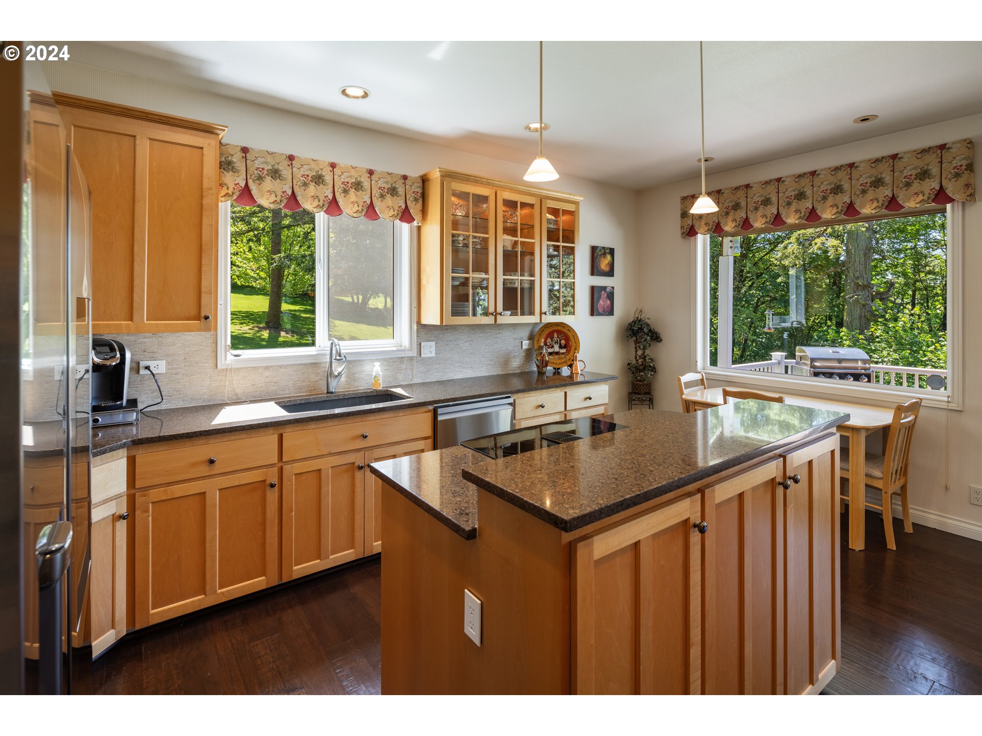 19100 Southwest Finnigan Hill Road Newberg, OR 97132 - Photo 13 of 48 a kitchen with kitchen island a large window in it