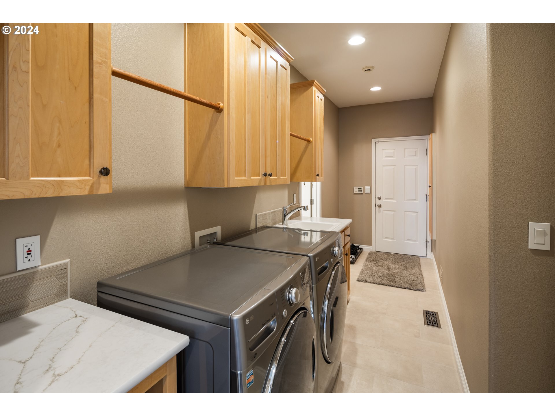 19100 Southwest Finnigan Hill Road Newberg, OR 97132 - Photo 19 of 48 a kitchen with a sink a stove and a refrigerator