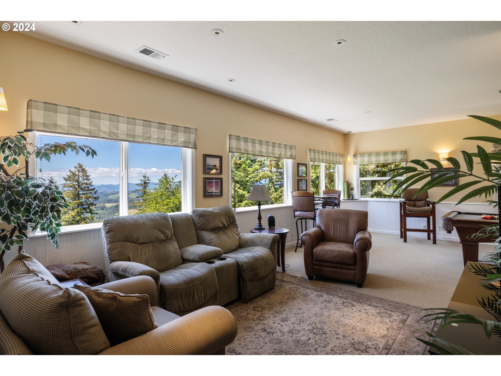 19100 Southwest Finnigan Hill Road Newberg, OR 97132 - Photo 25 of 48 a living room with furniture and a large window