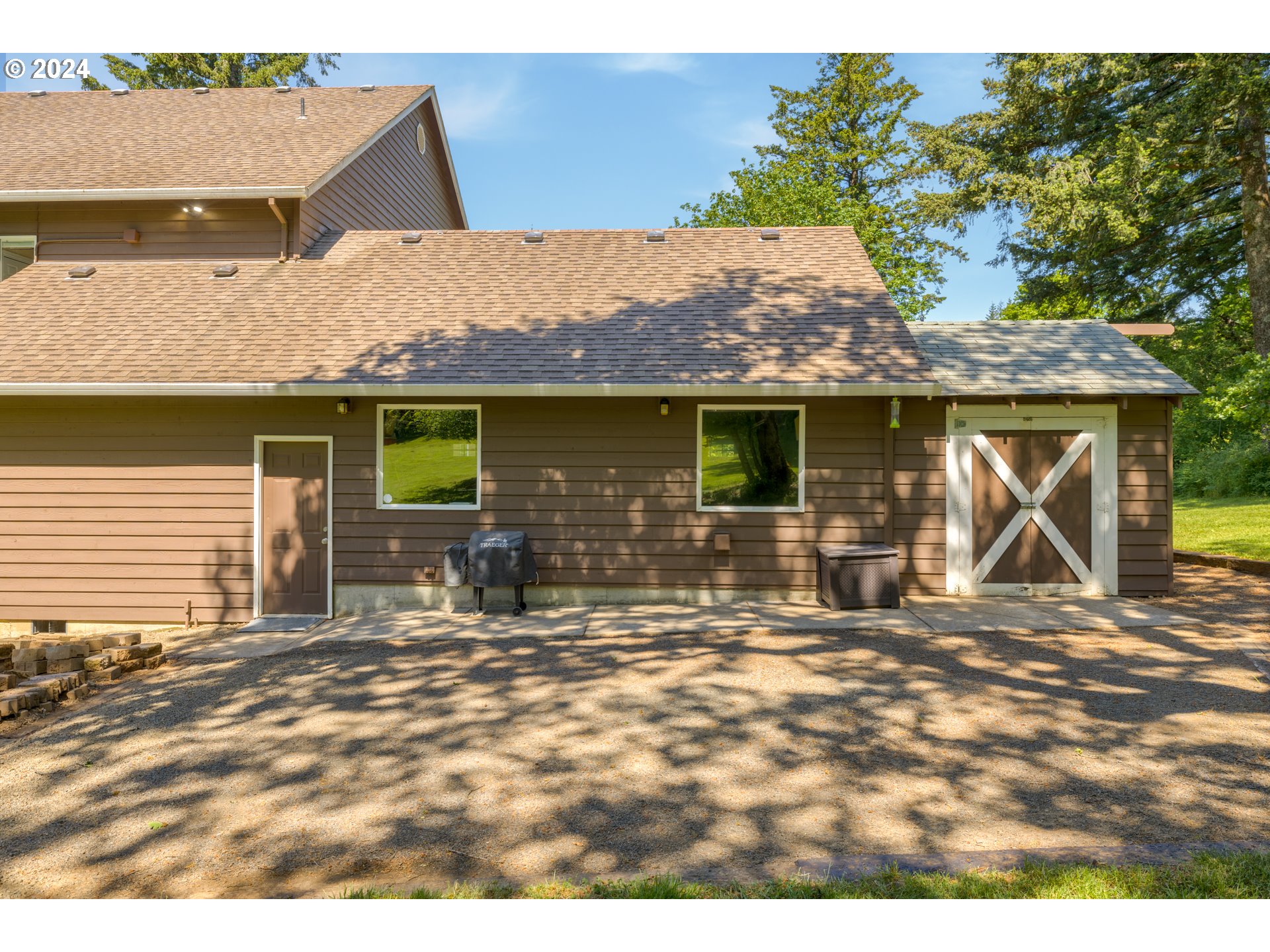 19100 Southwest Finnigan Hill Road Newberg, OR 97132 - Photo 36 of 48 a backyard of a house with yard and outdoor seating