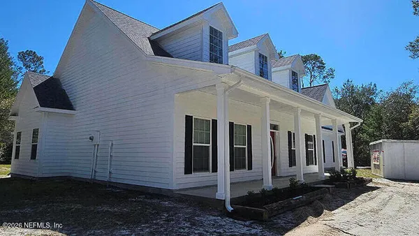 a view of a house with a street