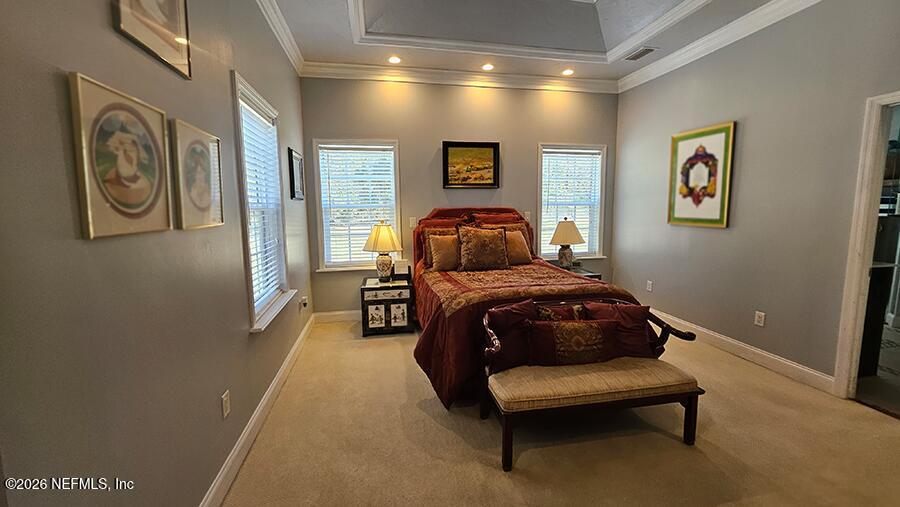 200 Mockingbird Court Georgetown, FL 32139 - Photo 11 of 30 a bedroom with a bed and painting on the wall