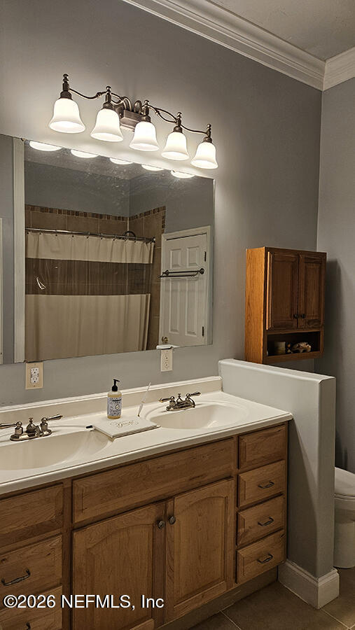 200 Mockingbird Court Georgetown, FL 32139 - Photo 17 of 30 a bathroom with a sink double vanity and a mirror