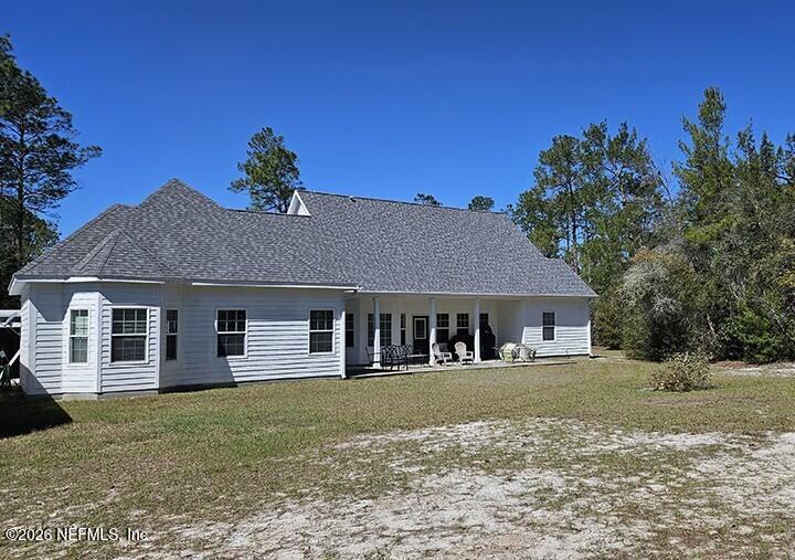 200 Mockingbird Court Georgetown, FL 32139 - Photo 4 of 30 a front view of a house with a garden
