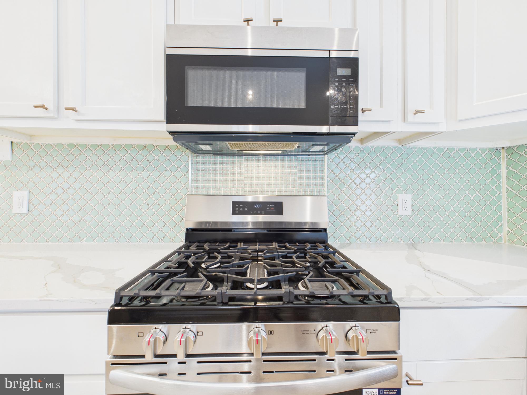 944 Balboa Avenue Capitol Heights, MD 20743 - Photo 11 of 49 a stove top oven sitting inside of a kitchen