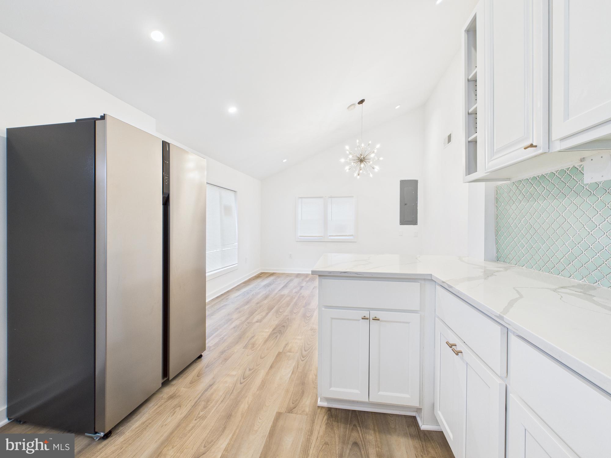 944 Balboa Avenue Capitol Heights, MD 20743 - Photo 15 of 49 a view of a kitchen with white cabinets