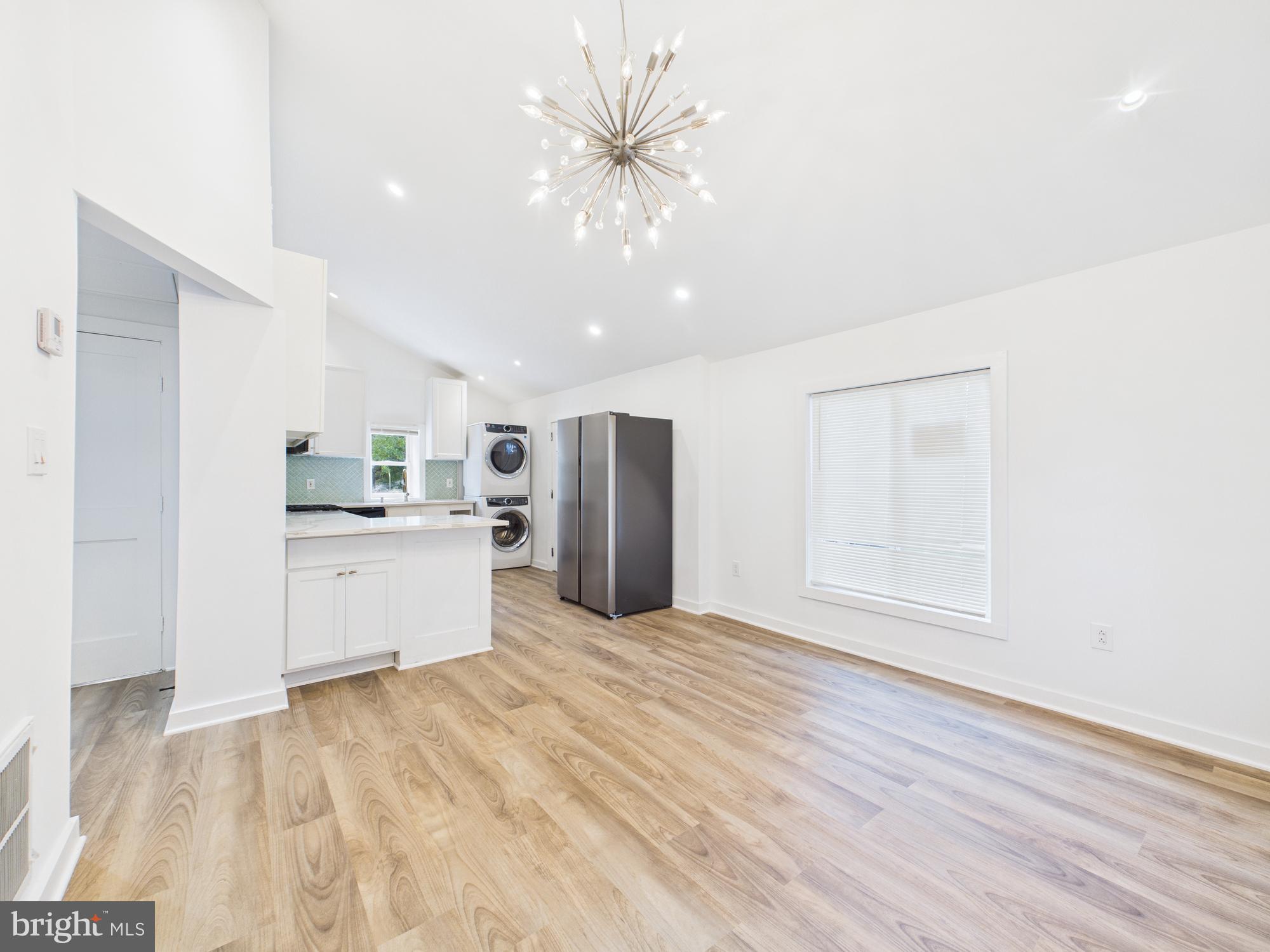 944 Balboa Avenue Capitol Heights, MD 20743 - Photo 18 of 49 a view of a kitchen with a sink and cabinet with wooden floor