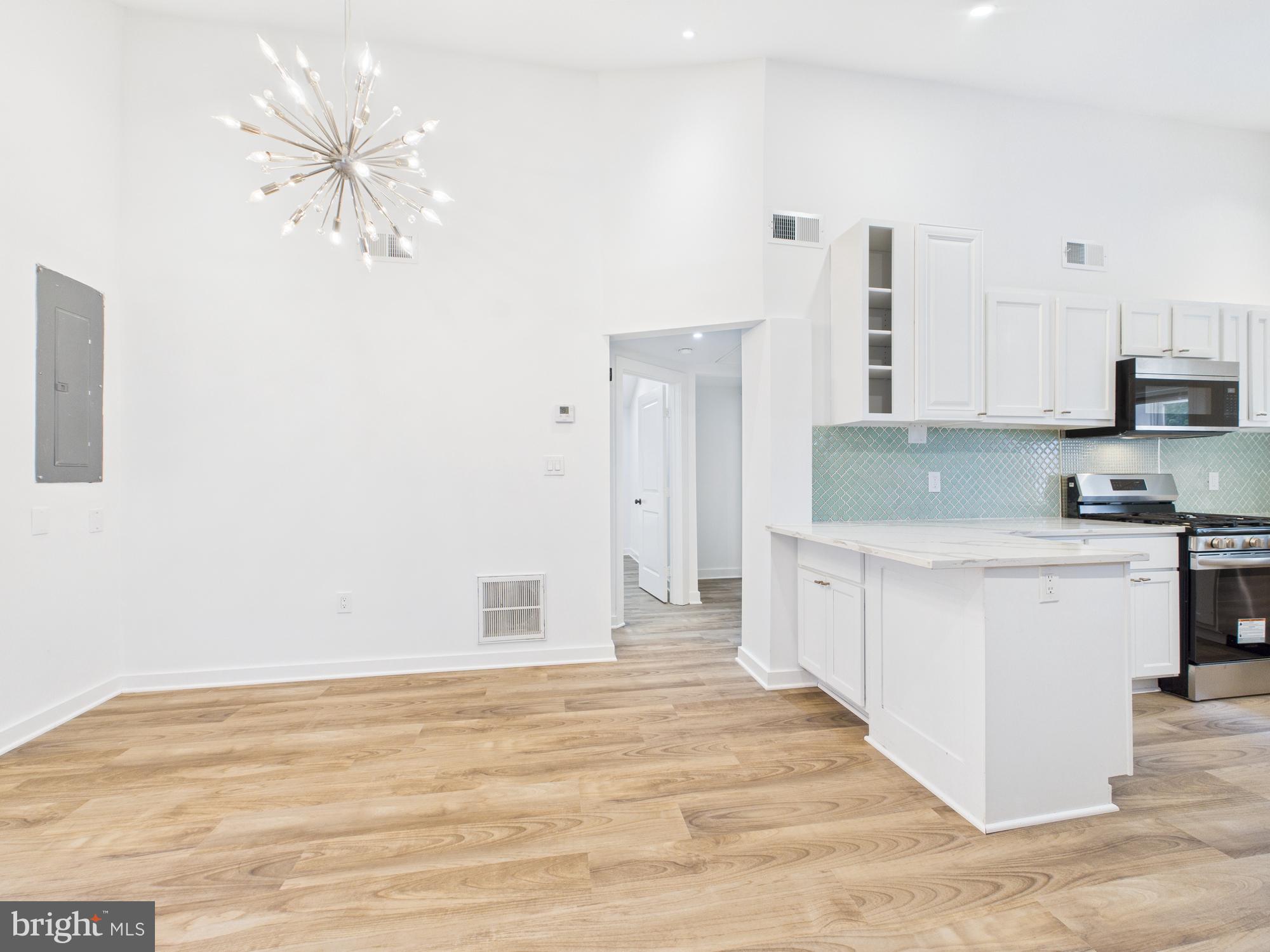 944 Balboa Avenue Capitol Heights, MD 20743 - Photo 20 of 49 a kitchen with stainless steel appliances white cabinets and a sink
