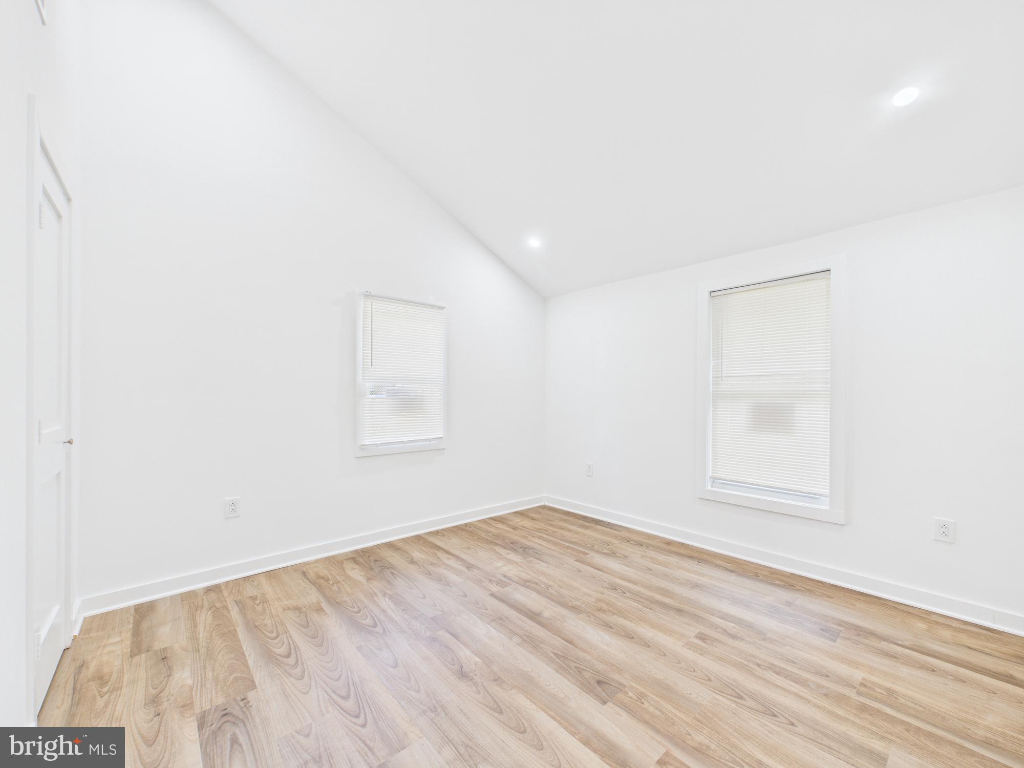 944 Balboa Avenue Capitol Heights, MD 20743 - Photo 22 of 49 an empty room with wooden floor and windows