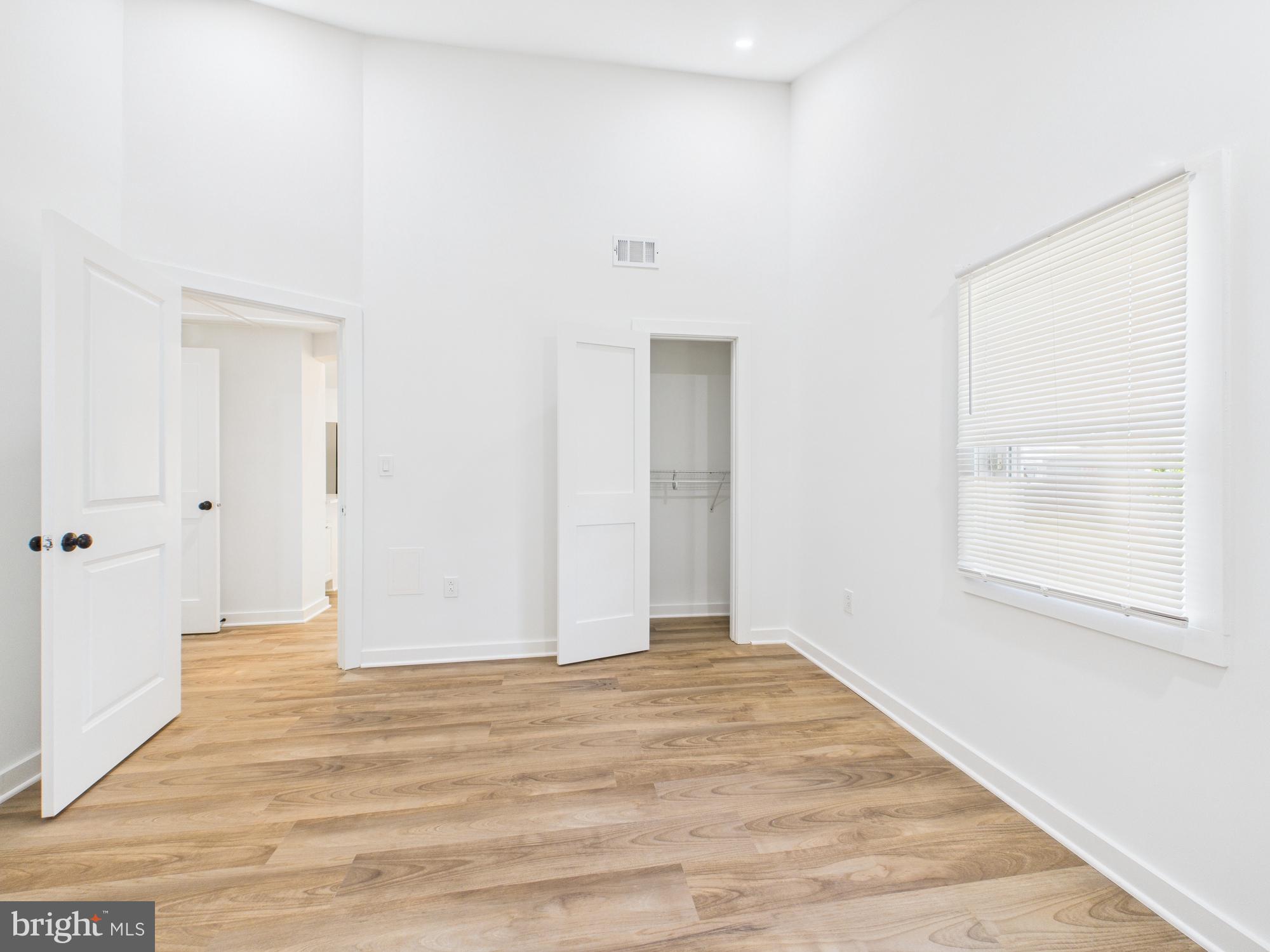 944 Balboa Avenue Capitol Heights, MD 20743 - Photo 23 of 49 a view of an empty room with wooden floor and a window