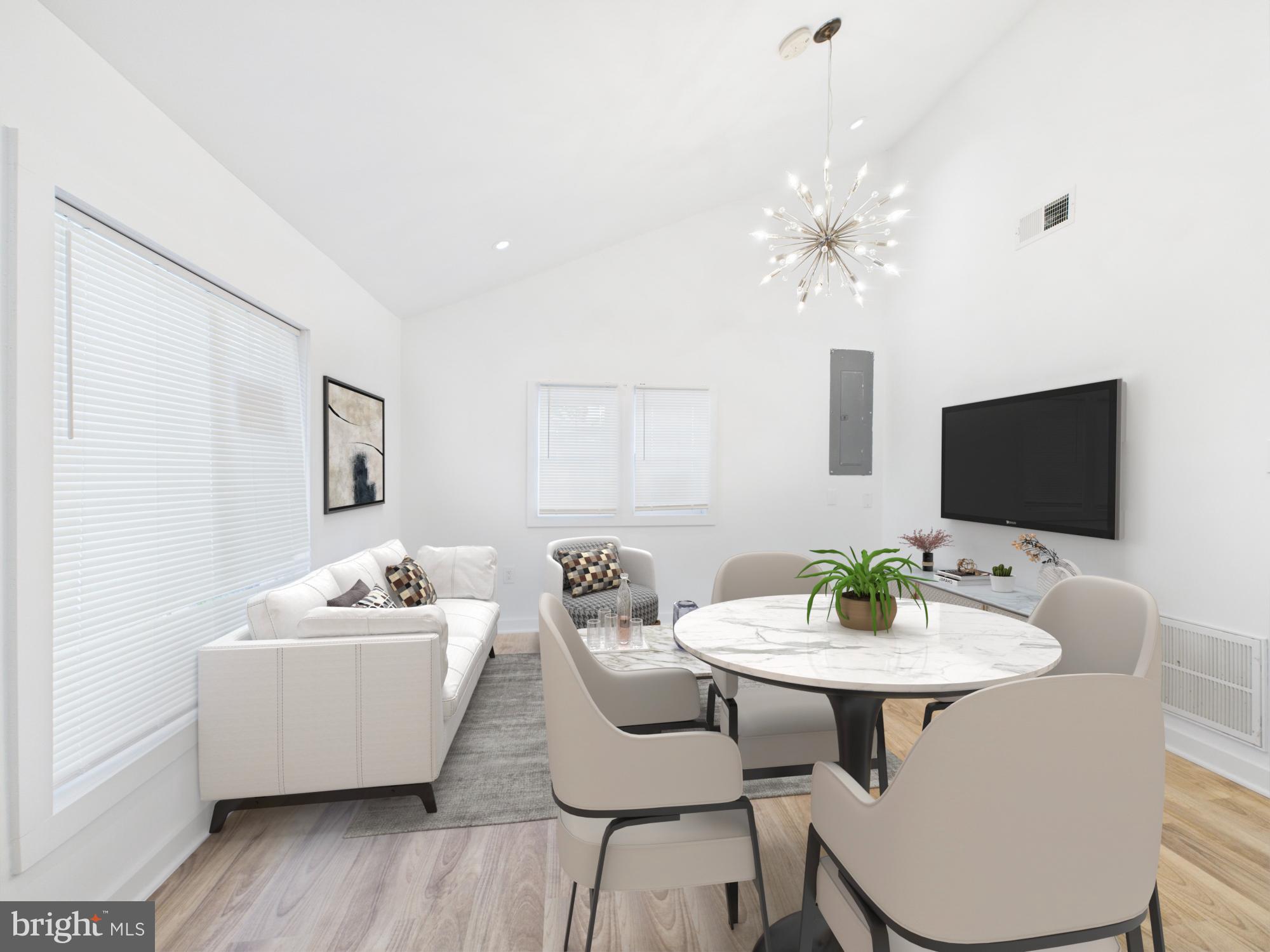 944 Balboa Avenue Capitol Heights, MD 20743 - Photo 3 of 49 a living room with furniture and a flat screen tv