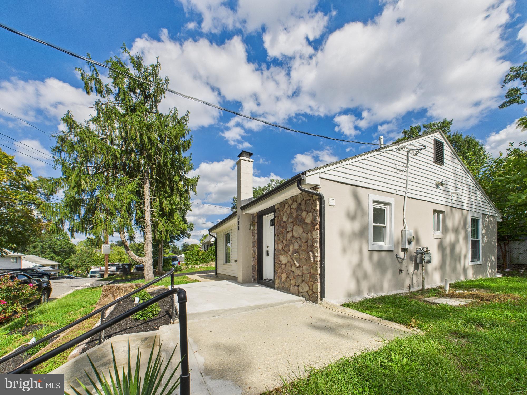 944 Balboa Avenue Capitol Heights, MD 20743 - Photo 34 of 49 a front view of a house with a yard and garage