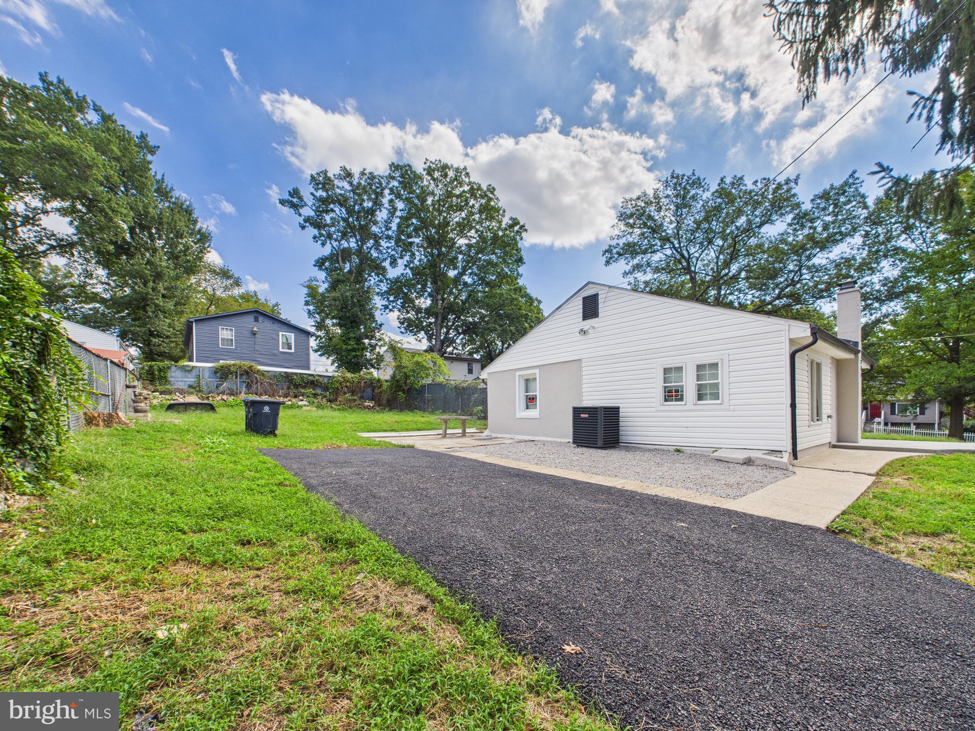 944 Balboa Avenue Capitol Heights, MD 20743 - Photo 37 of 49 a view of a house with a yard and large trees