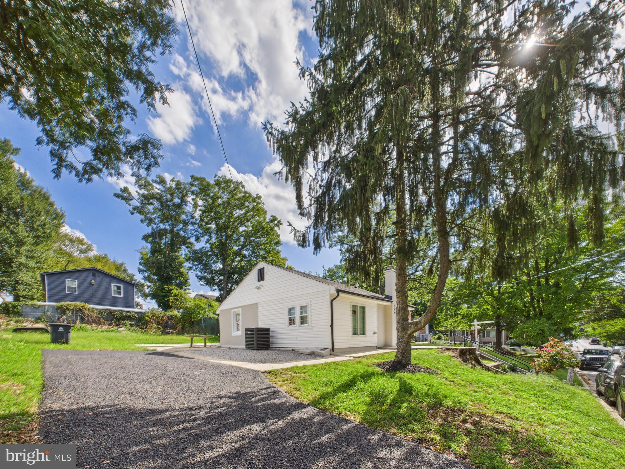 944 Balboa Avenue Capitol Heights, MD 20743 - Photo 44 of 49 a view of a yard in front of a house with large trees