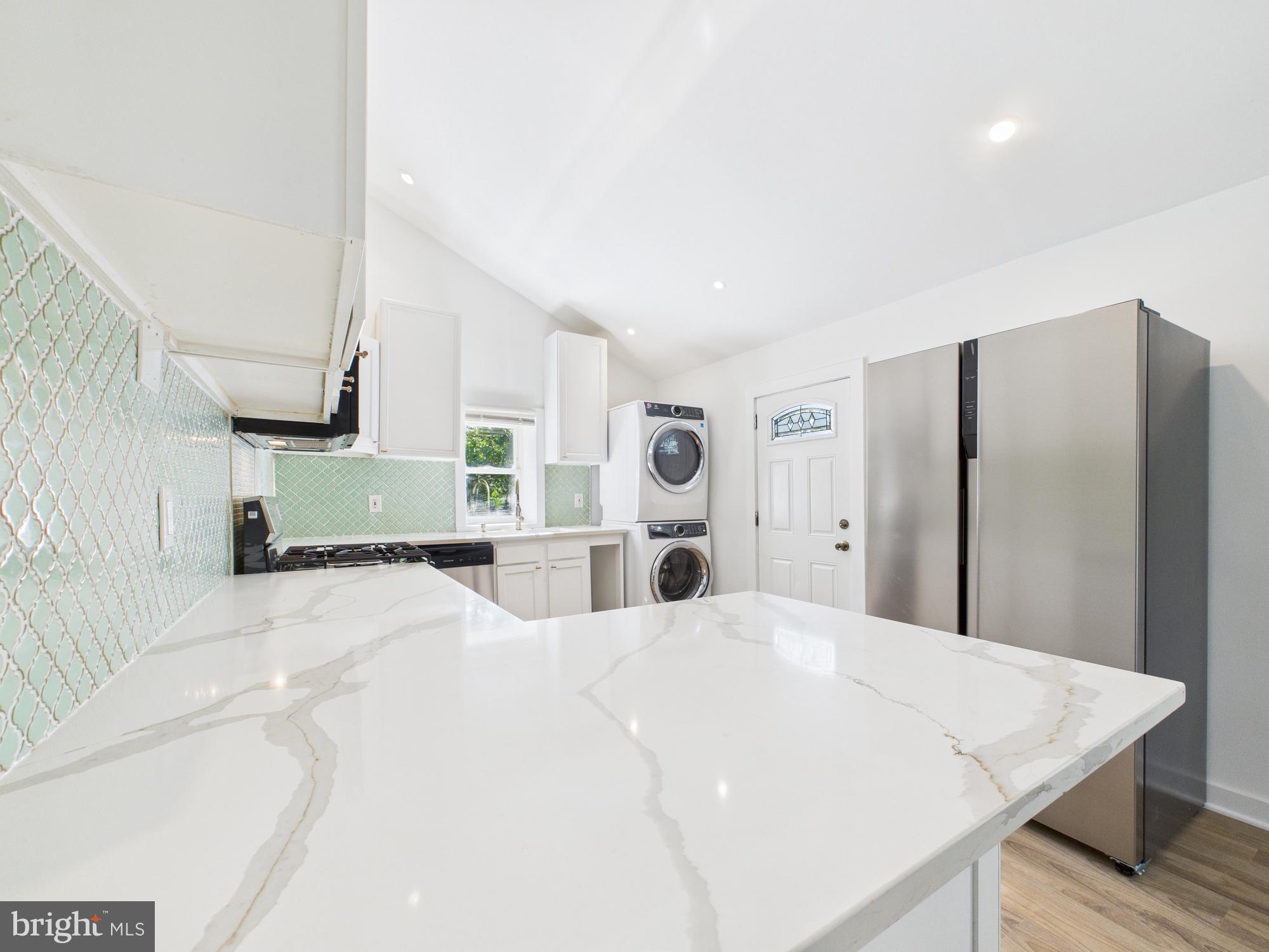 944 Balboa Avenue Capitol Heights, MD 20743 - Photo 8 of 49 a large white bed in a white room