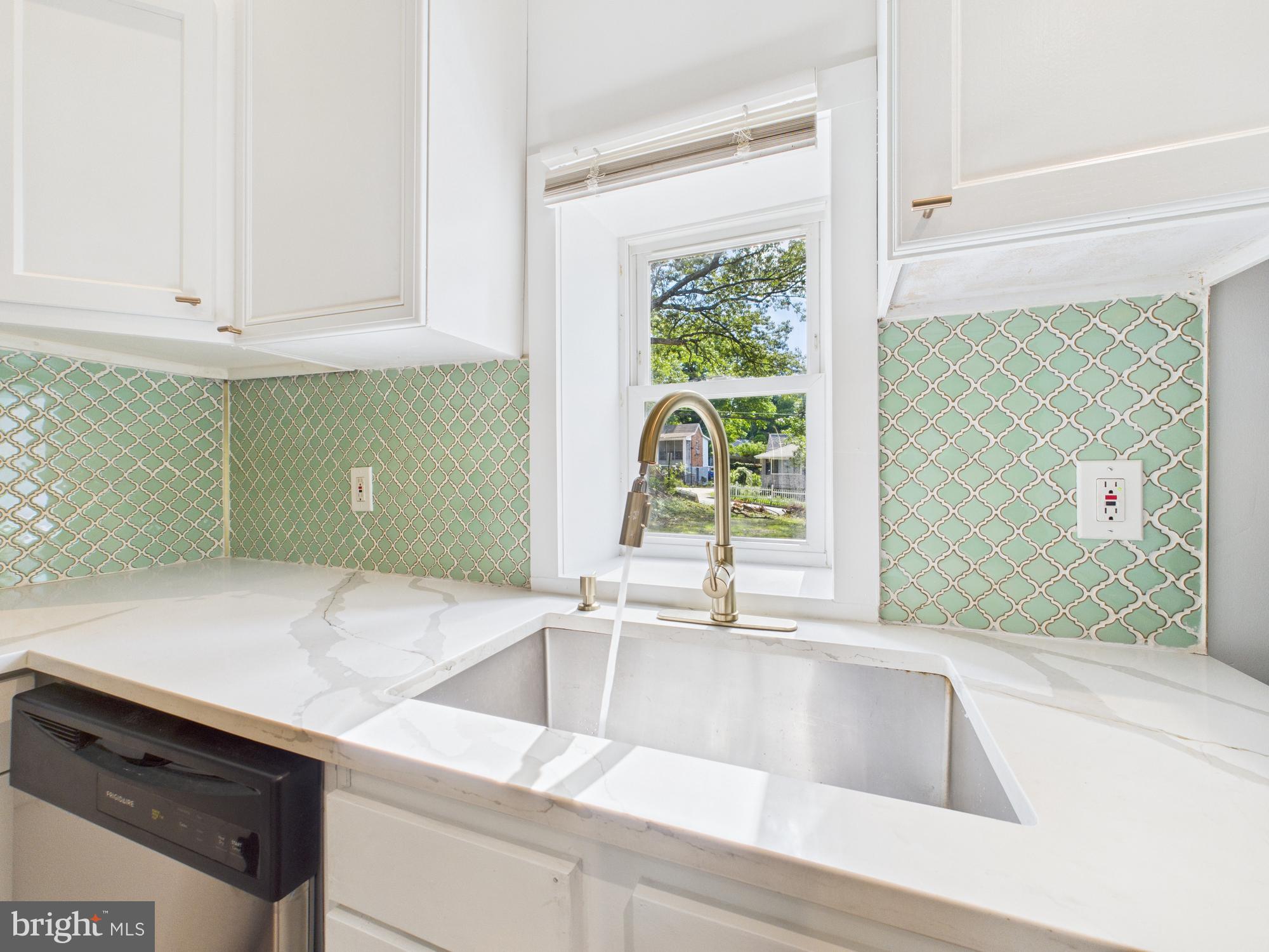 944 Balboa Avenue Capitol Heights, MD 20743 - Photo 9 of 49 a kitchen with a sink and a large window