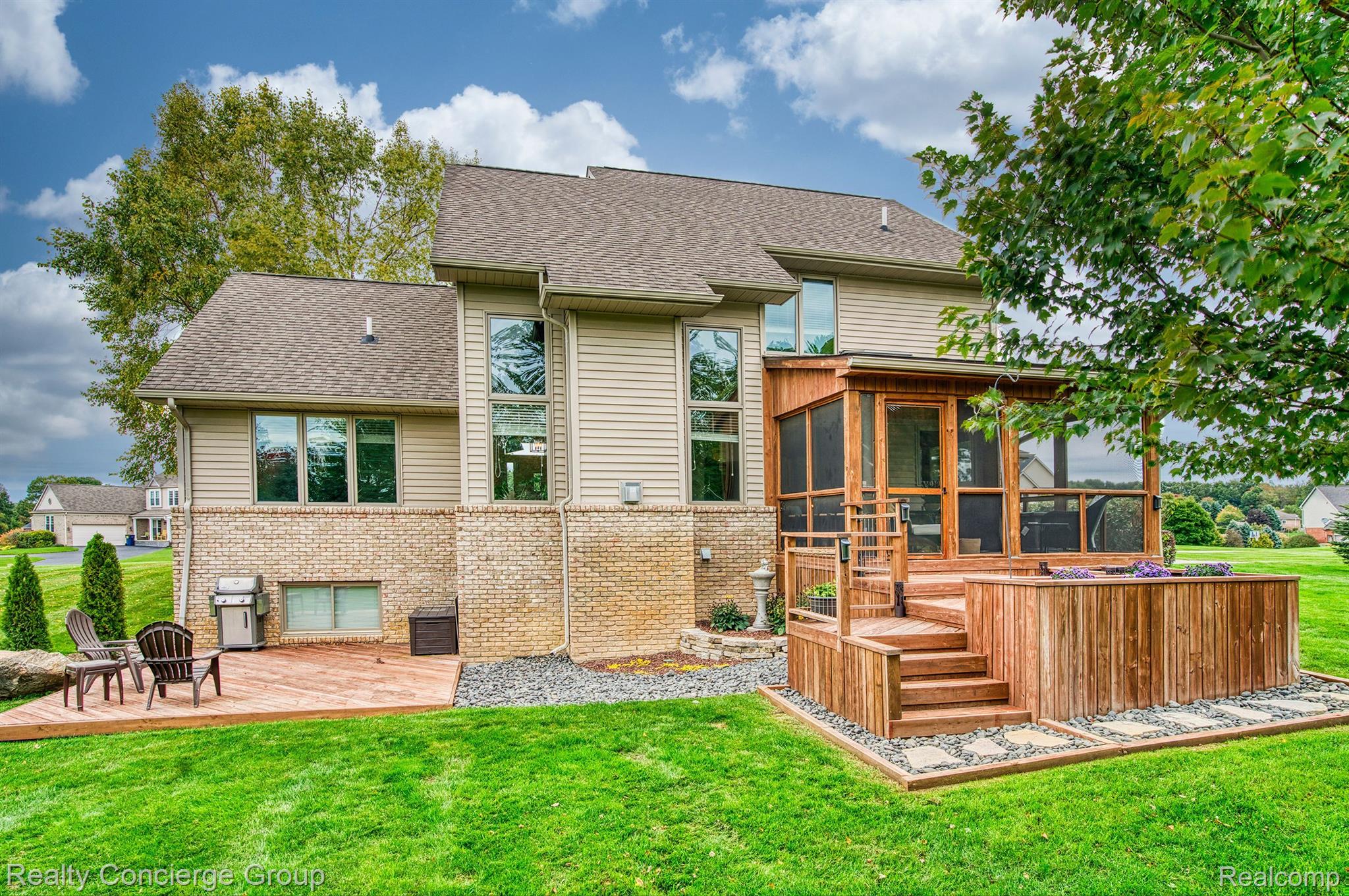 1172 Thorn Ridge Drive Howell, MI 48843 - Photo 52 of 71 Enjoy time outside on the deck & raised deck area