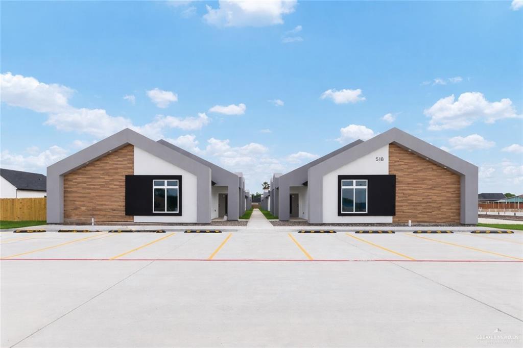 518 East E Loop, Unit 10 Harlingen, TX 78550 - Photo 1 of 14 a view of the house with a yard