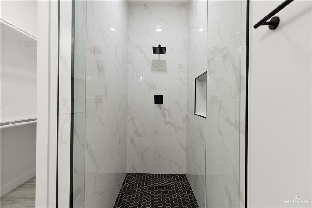 518 East E Loop, Unit 10 Harlingen, TX 78550 - Photo 12 of 14 a bathroom with a shower